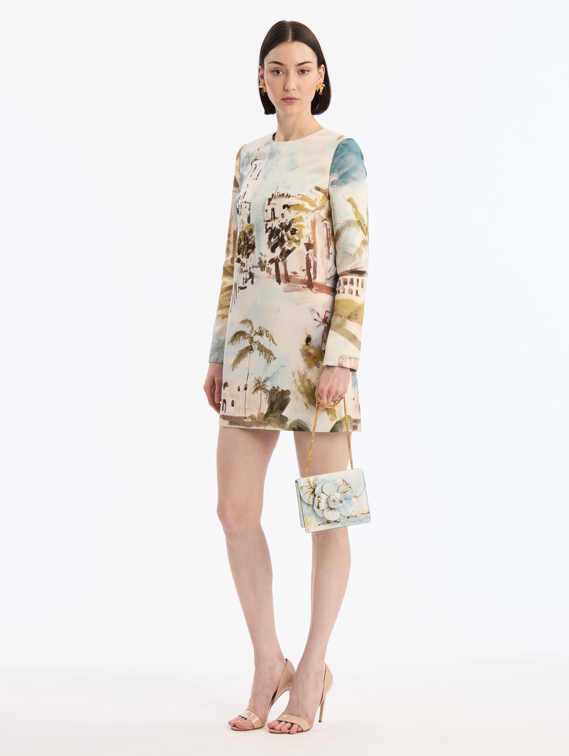 Mini Leather shoulder bag with Dominican Landscape Print. Rectangular with flower closure. Gold Chain strap. Front View.