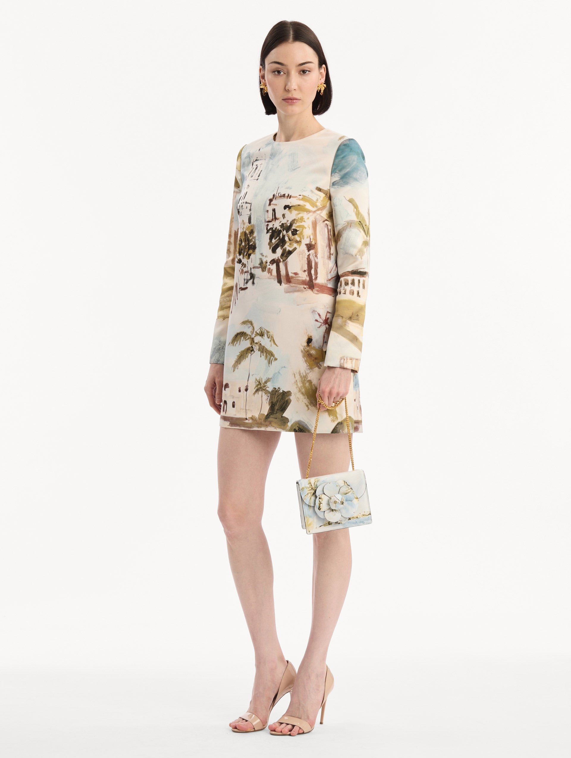 The model is wearing the Dominican Landscape Printed Mini TRO Bag in Saltwater Blue. Full-Body View.