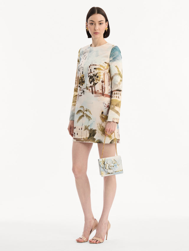 The model is wearing the Dominican Landscape Printed Mini TRO Bag in Saltwater Blue. Full-Body View.