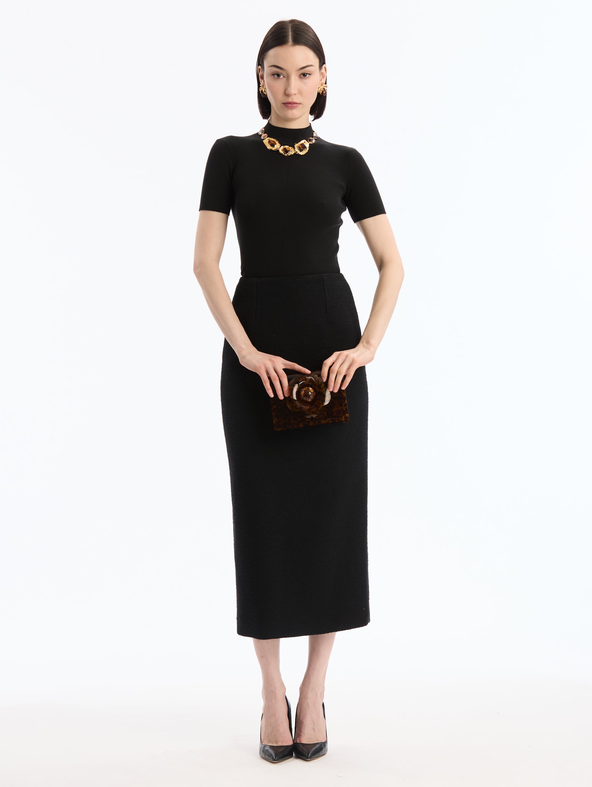 Tortoise Plexiglass Mini TRO Bag (Clutch). Rectangular with central flower detail. Front View.