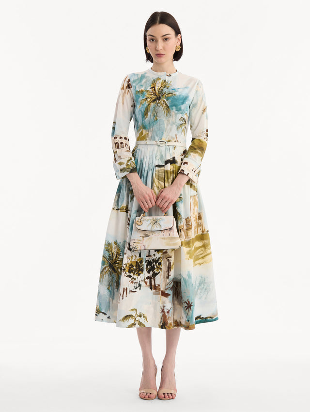 The model is wearing The Mini Poppy adorned with the Dominican Landscape print. Full-Body View.