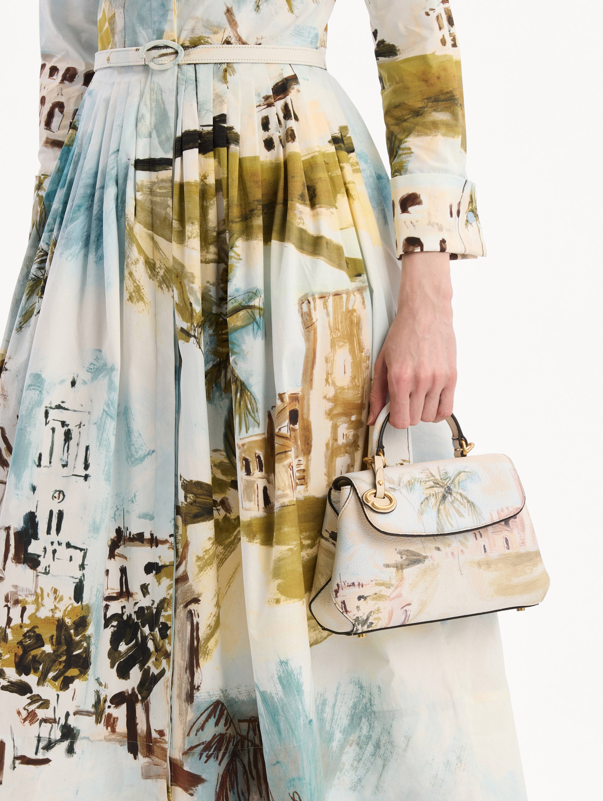 The model is wearing The Mini Poppy adorned with the Dominican Landscape print. Detail View.
