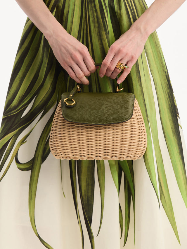 The model is wearing The Mini Poppy in Wicker in Olive. Front View.