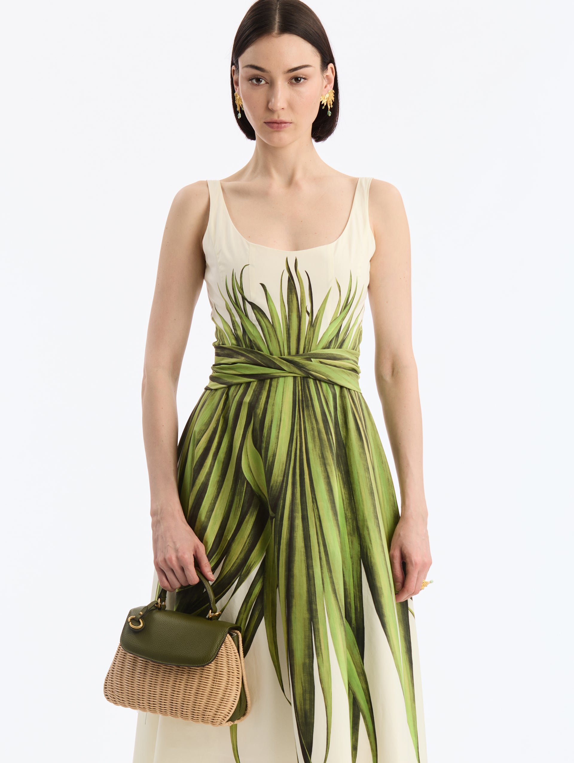 Mini Top Handle bag in green leather and wicker. Front View. 