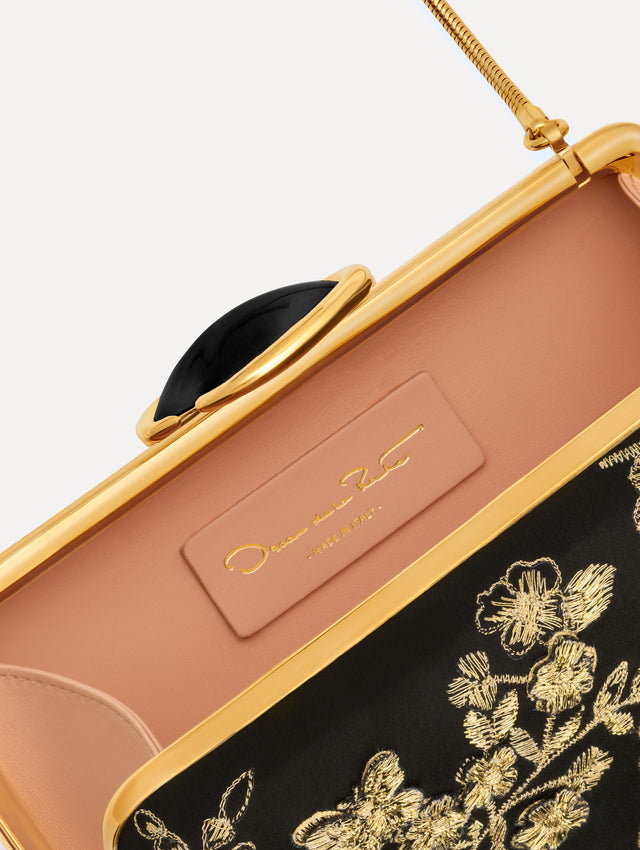The Butterfly Embroidered O Minaudière in Black Satin with Gold Butterfly Embroidery. Detail View.