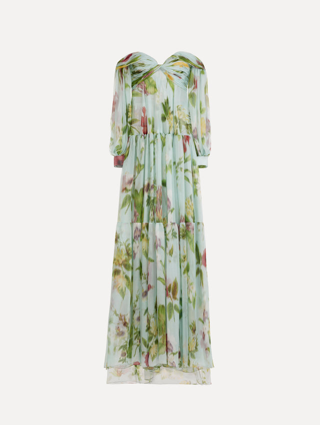 The Chiné Dominican Mixed-Floral Chiffon Sweetheart Gown. Featuring an off-the-shoulder sweetheart neckline, long sleeves, and flowing, tiered skirt. Front View.