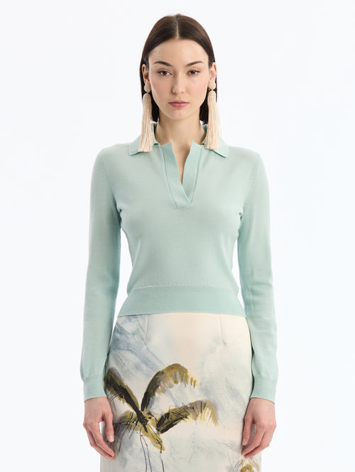 Light Blue Wool Polo Pullover, V-Neck with Collar. Full Length Sleeves. Close Up Front View. 