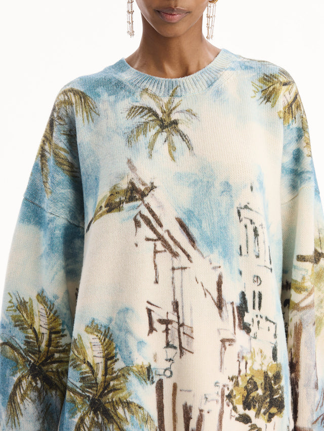 The model is wearing the Dominican Landscape Oversized Pullover. Featuring a crew neckline, long sleeves, ribbed trim, and an oversized fit. Detail View.