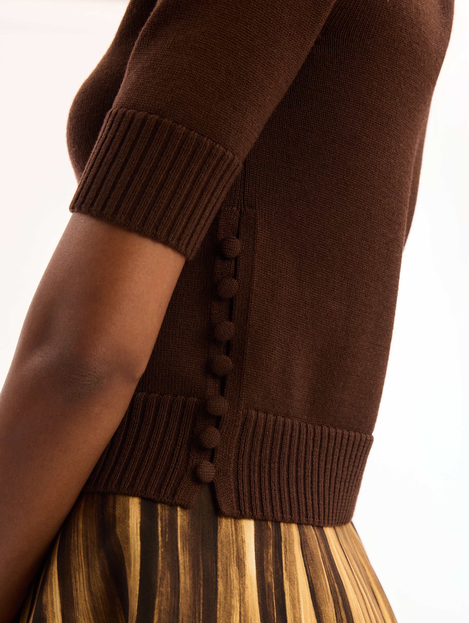 Dark Brown, Short Sleeve, Crew Neck, Pullover. Button Detailing on Side. Close Up Side View. 