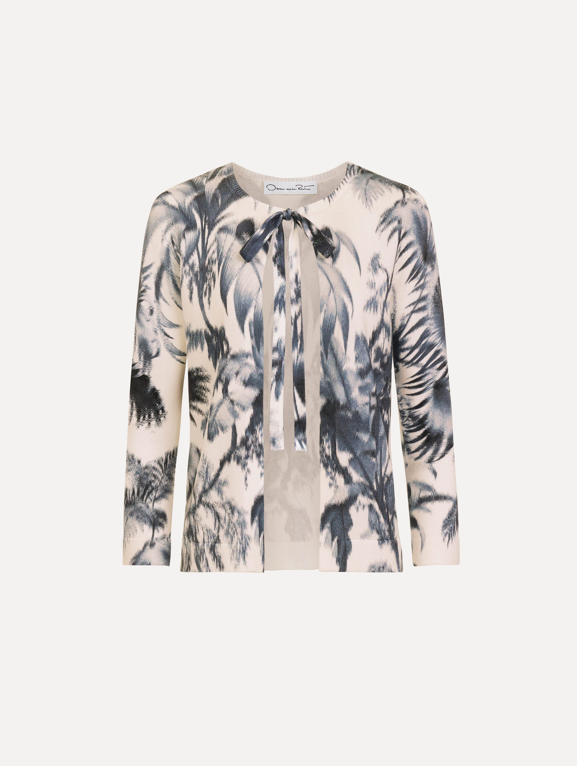 The Chiné Palm Leaves Cardigan in Navy and White. Featuring a crew neckline, quarter-length sleeves, banded trim, and tie front closure. Front View.