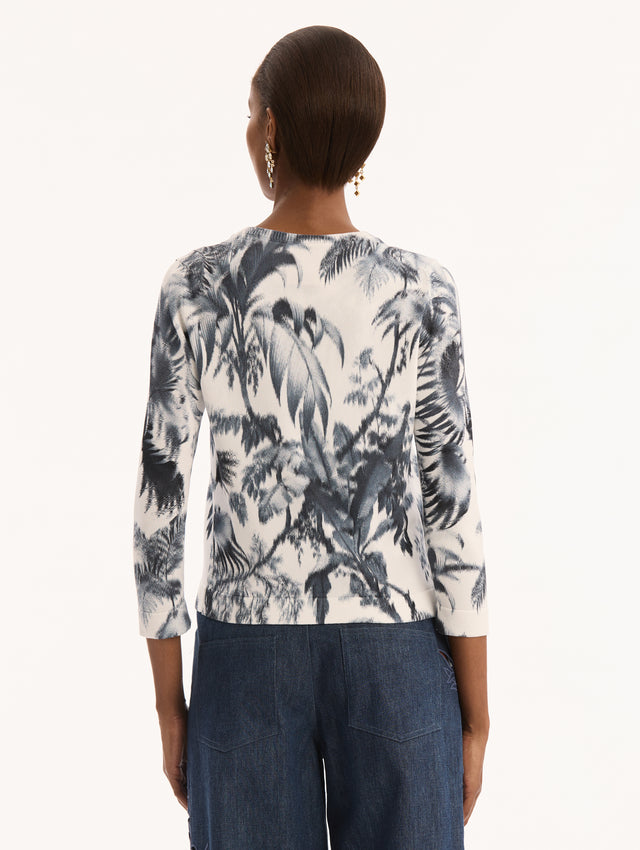 Ivory Three Quarter Length Sleeve Cardigan with Bow Tie Closure at Neck and Navy Chiné Palm Leaves Print. Back View. 