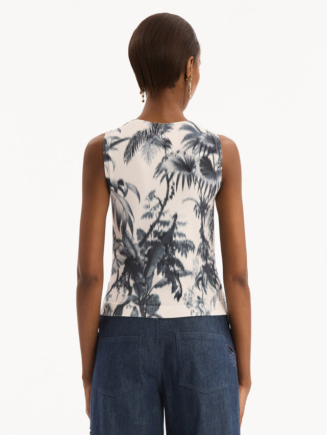The model is wearing the Chiné Palm Leaves Tank in Navy and White. Featuring a crew neckline and banded trim. Back View.