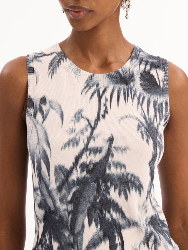 The model is wearing the Chiné Palm Leaves Tank in Navy and White. Featuring a crew neckline and banded trim. Detail View.