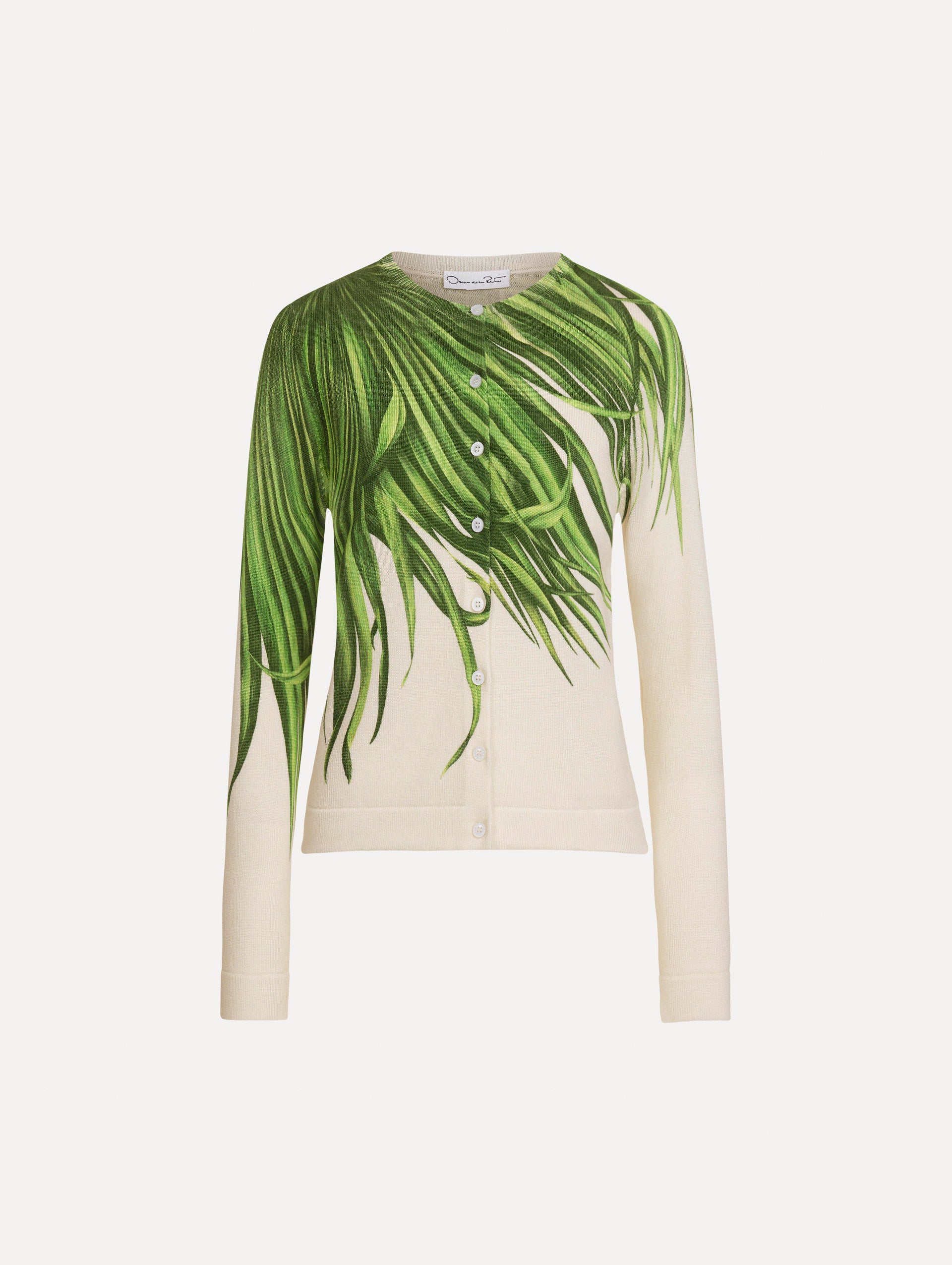 The Palm Leaves Cardigan in Green and Ivory. Featuring front button closures, a crew neckline, long sleeves, and banded trim. Front View.
