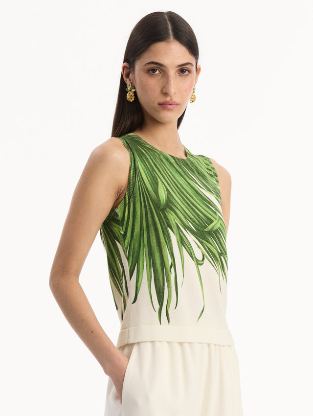 The model is wearing the Palm Leaves Tank in Green and Ivory. Featuring a crew neckline and banded trim. Side View.
