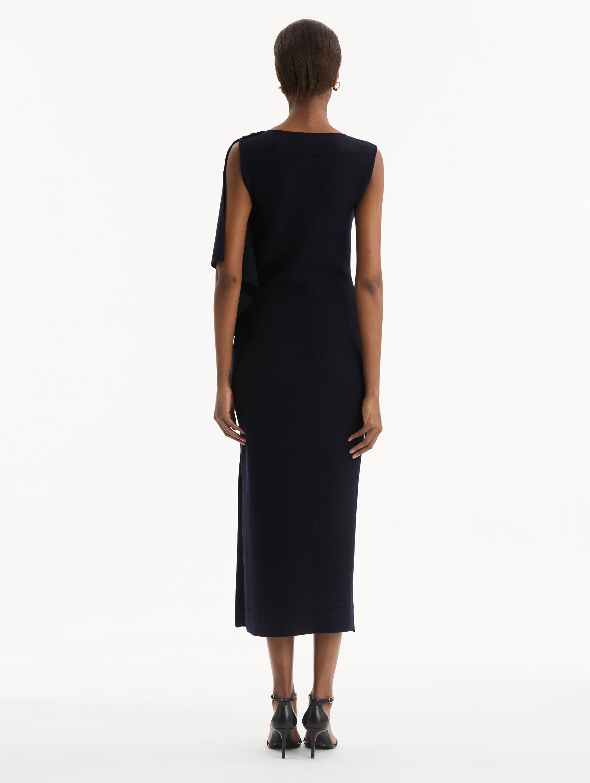 Hibiscus Brooch Knit Dress in Navy. Back view.