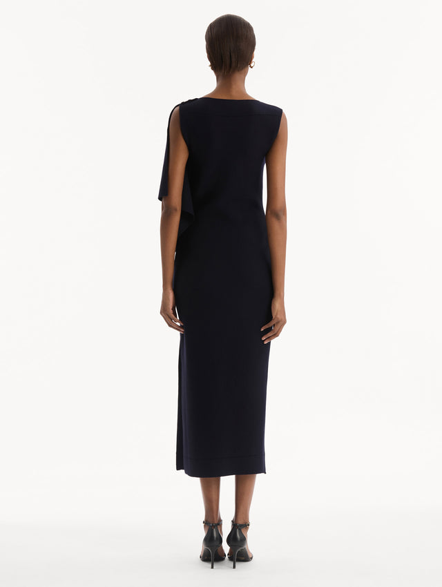 Hibiscus Brooch Knit Dress in Navy. Back view.