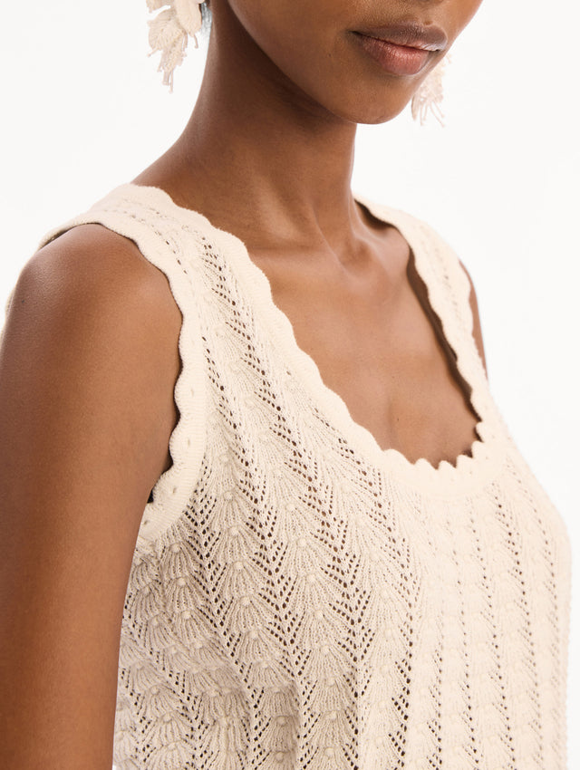 The model is wearing the Pointelle Weave Tank in Ivory. Featuring a scoop neckline, thick tank straps, and scalloped edges. Detail View.