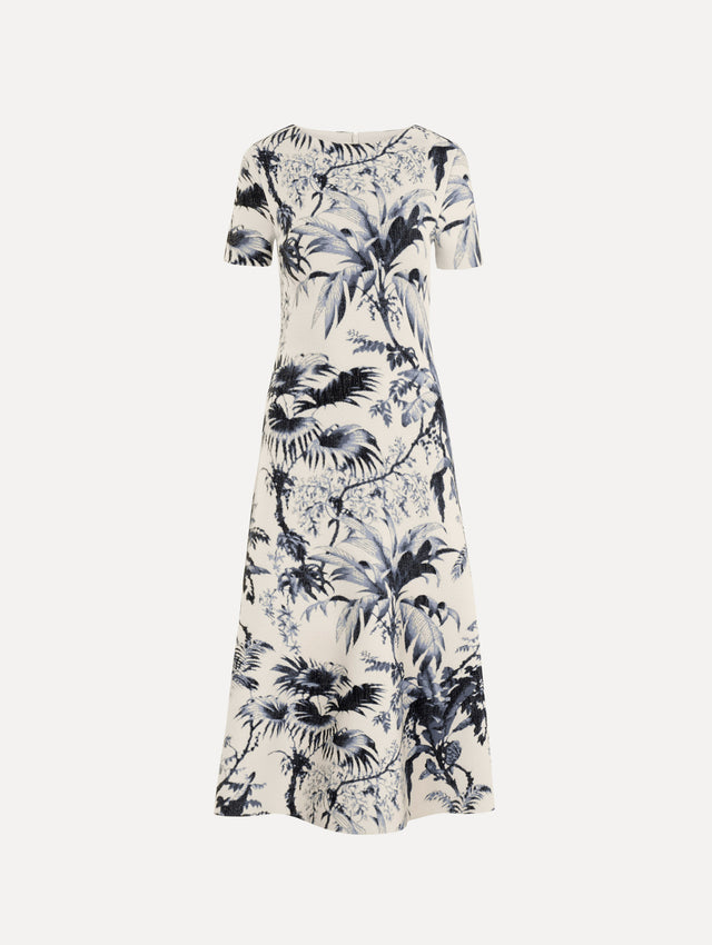 The Chiné Palm Leaves Knit Dress in Navy and Ivory. Featuring a classic silhouette with short sleeves and an A-line midi skirt. Front View.