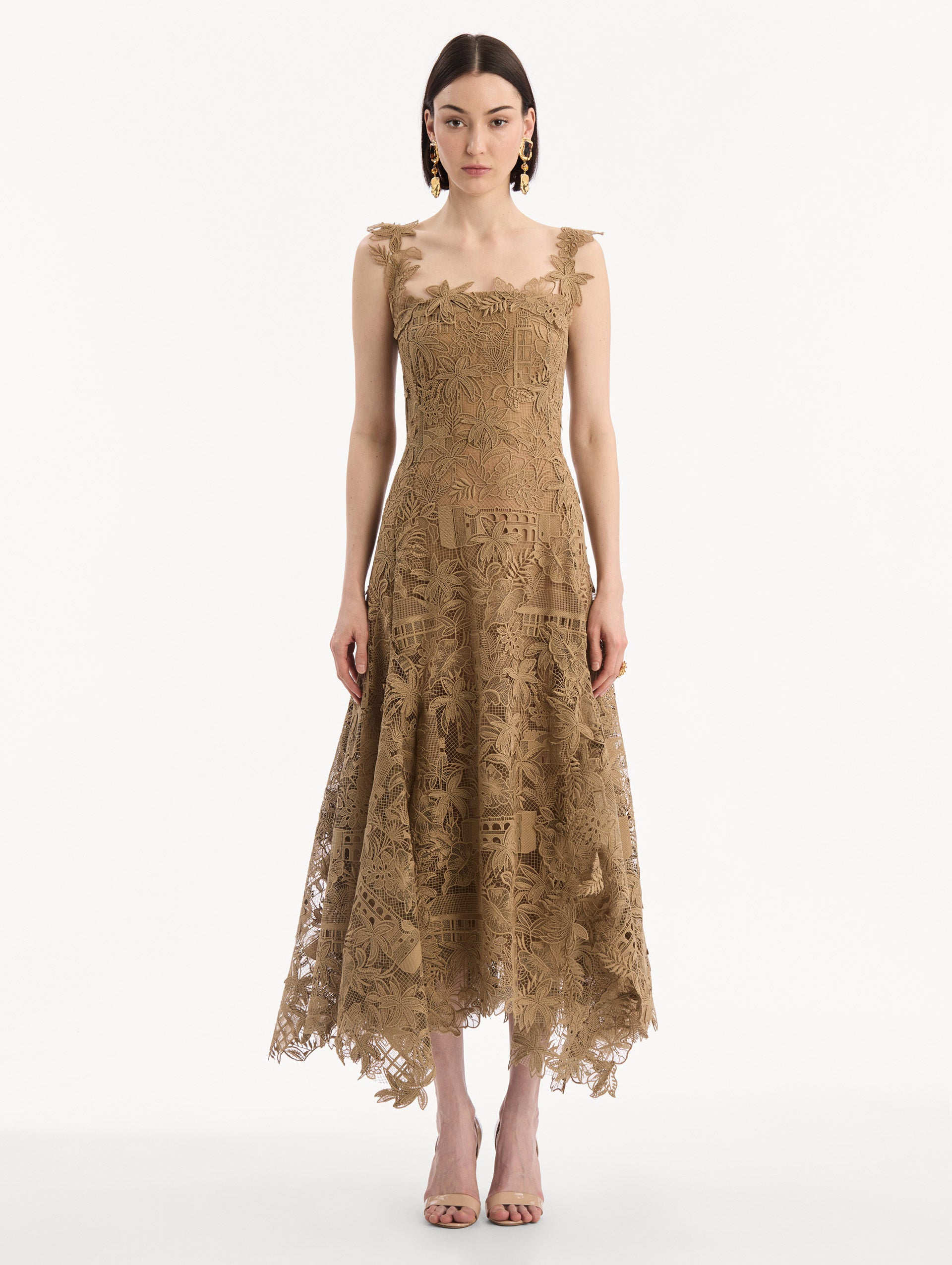 The model is wearing the Dominican Landscape Guipure Dress. Featuring a square neckline, tank straps, and lace guipure fabrication. Front View.