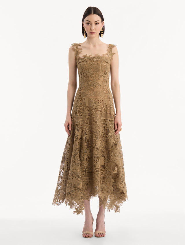 The model is wearing the Dominican Landscape Guipure Dress. Featuring a square neckline, tank straps, and lace guipure fabrication. Front View.