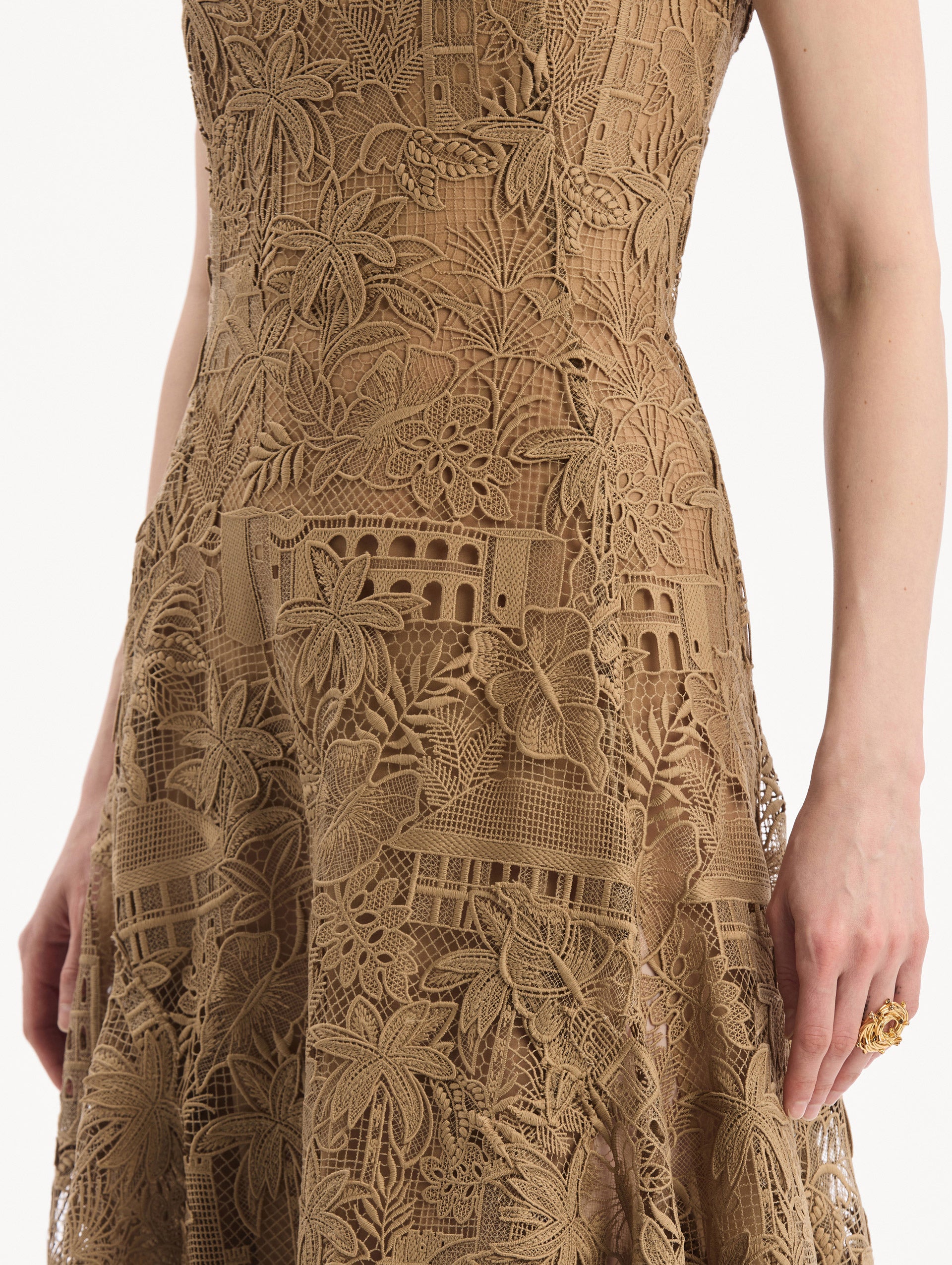 The model is wearing the Dominican Landscape Guipure Dress. Featuring a square neckline, tank straps, and lace guipure fabrication. Detail View.
