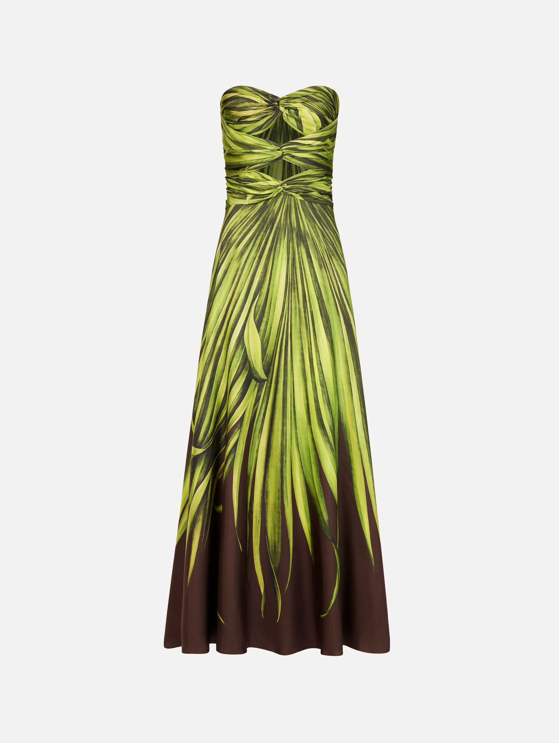 The Palm Leaves Silk Twill Cocktail Dress. Featuring a strapless silhouette, subtle cut-outs at the bodice, and a long skirt. Front View.