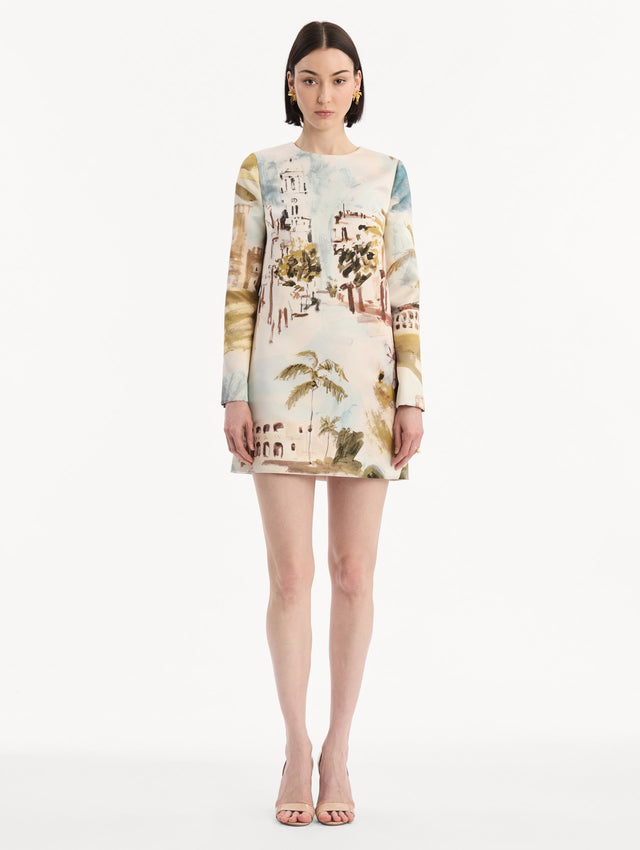 The model is wearing the Dominican Landscape Shift Dress. Featuring long sleeves and a mini length. Front View.