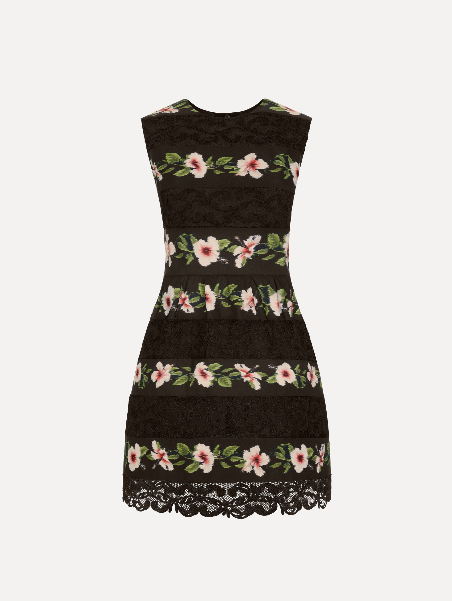 The Chiné Hibiscus Striped Faille Dress in Black. Featuring woven hibiscus motifs alternating with panels of faille and guipure lace, creating a striped pattern. Mini length. Front View.