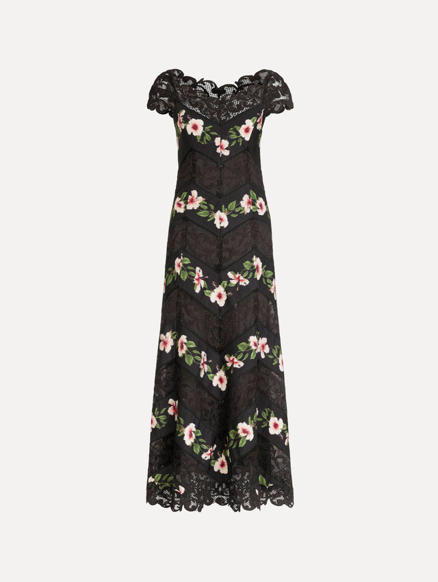 The Chiné Hibiscus Striped Faille Midi Dress in Black. Featuring off-the-shoulder cap sleeves, a midi length, and woven hibiscus motifs alternating with panels of faille and guipure lace, creating a striped composition. Front View.