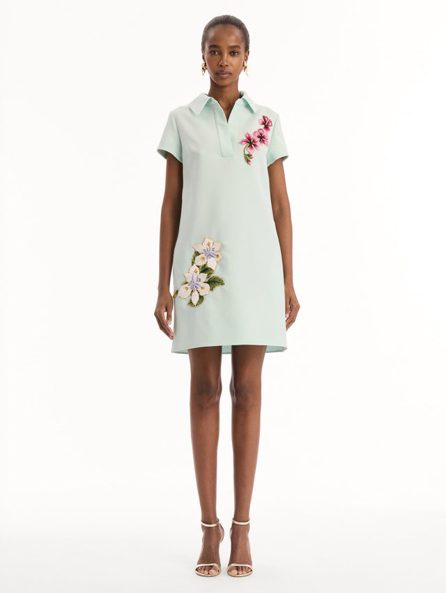The model is wearing the Dominican Mixed-Floral Threadwork Shift Dress in Saltwater. Featuring open collar neckline and mini length. Front View.