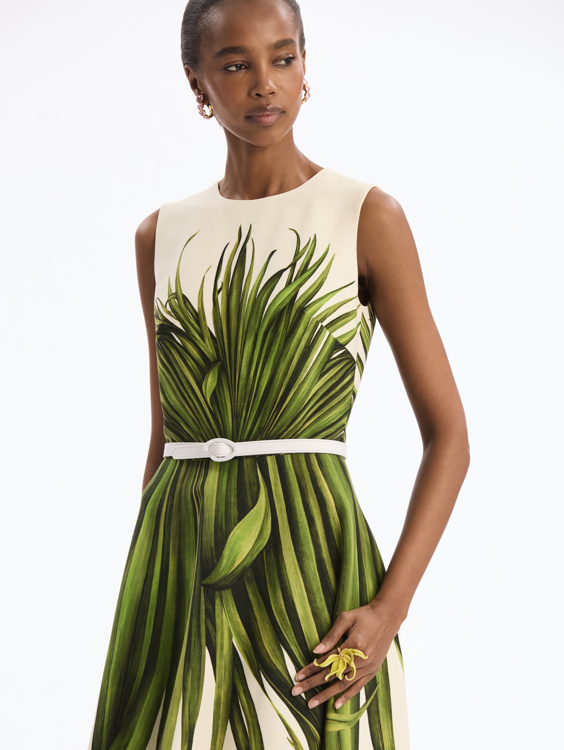 Ivory Wool Blend Dress with Green Palm Leaves Print. White Belt. Midi Length Dress. Boat Neck. Close Up Side View. 