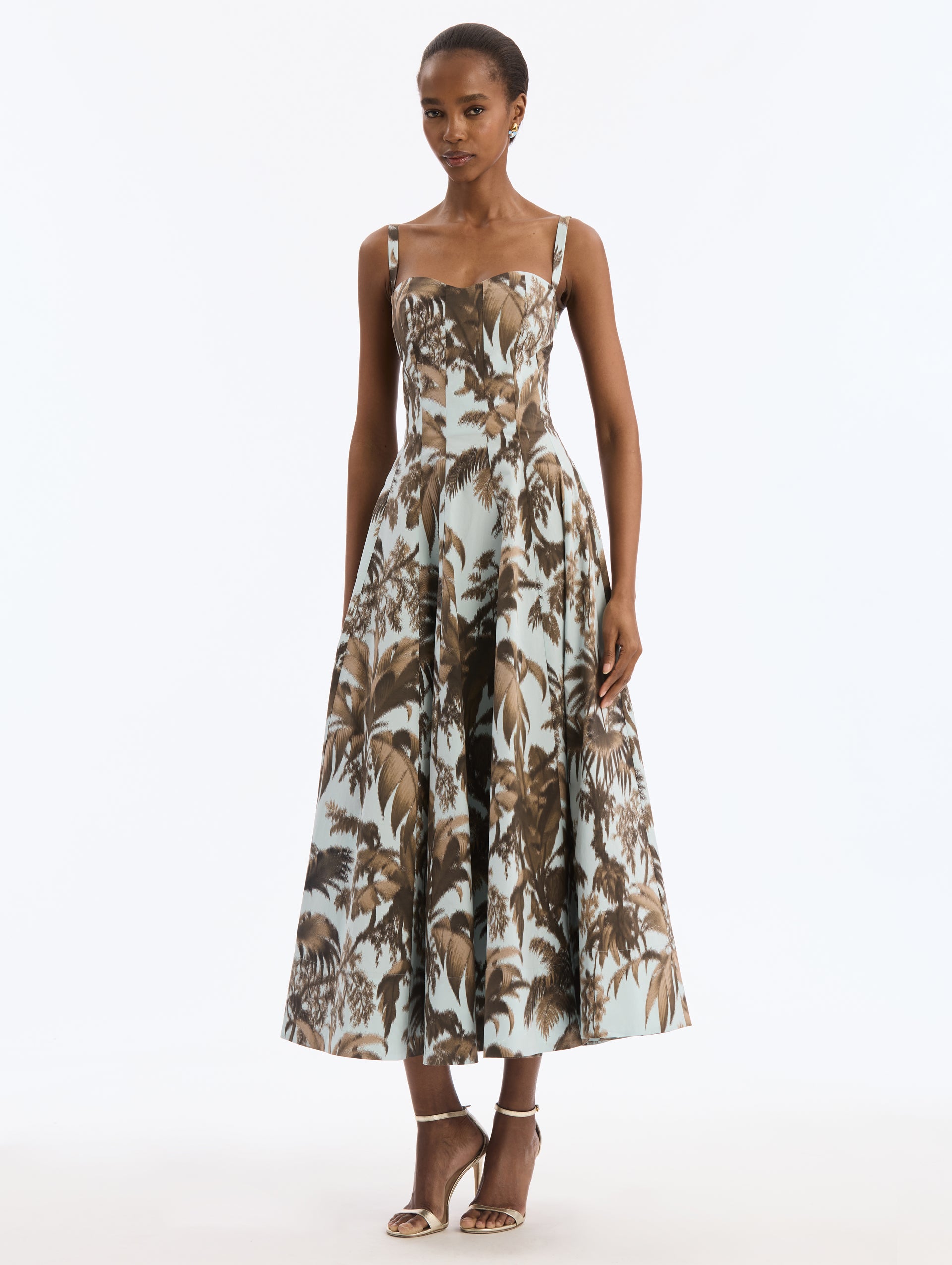 Blue Cotton Poplin Dress with Brown Chiné Palm Leaves. Delicate straps. Corseted Bodice, Pleated Skirt. Front View.