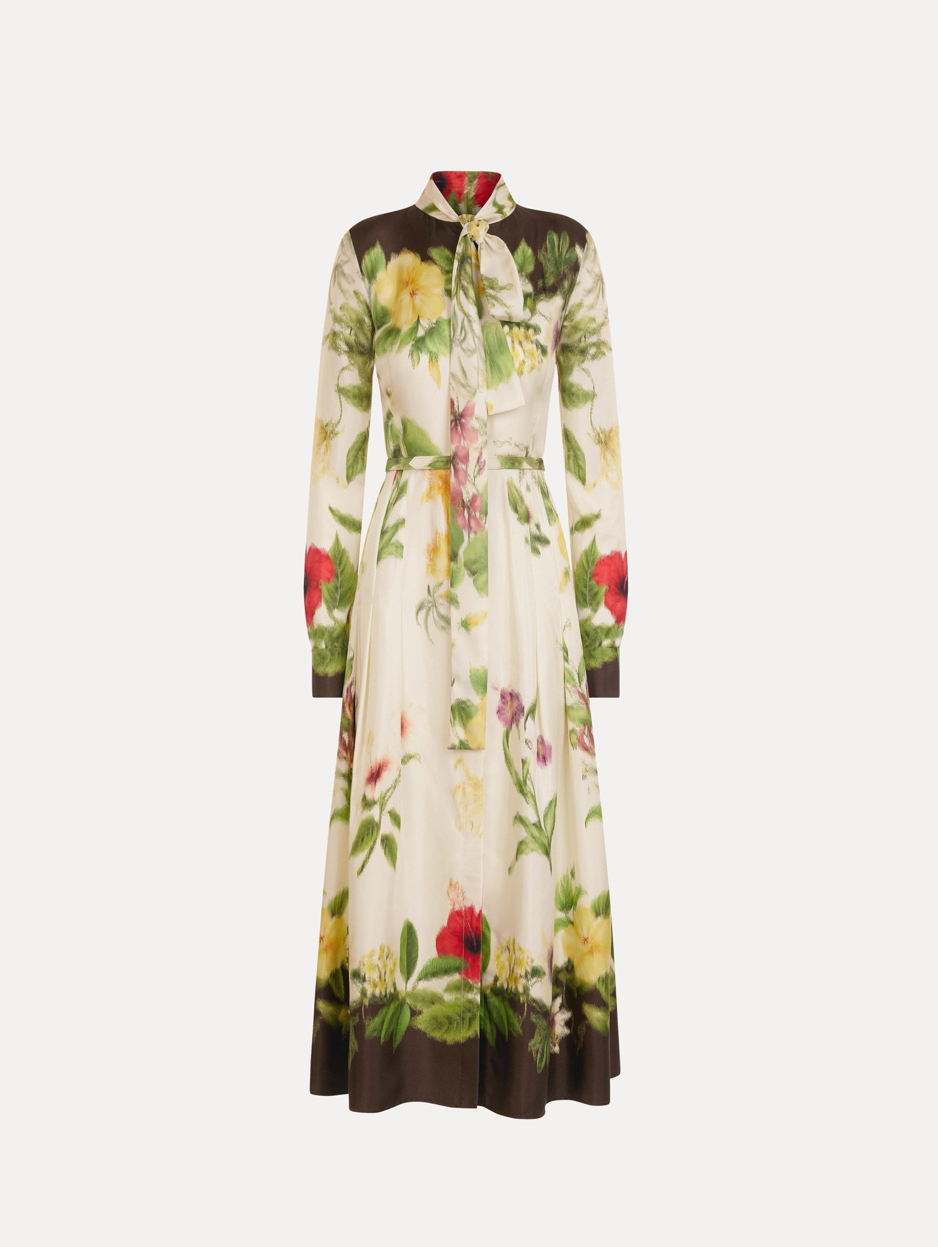 The Chiné Dominican Mixed-Floral Silk Twill Dress. Featuring a vibrant array of Dominican florals, tie neckline, belt at waist, long sleeves, and a midi length. Front View.