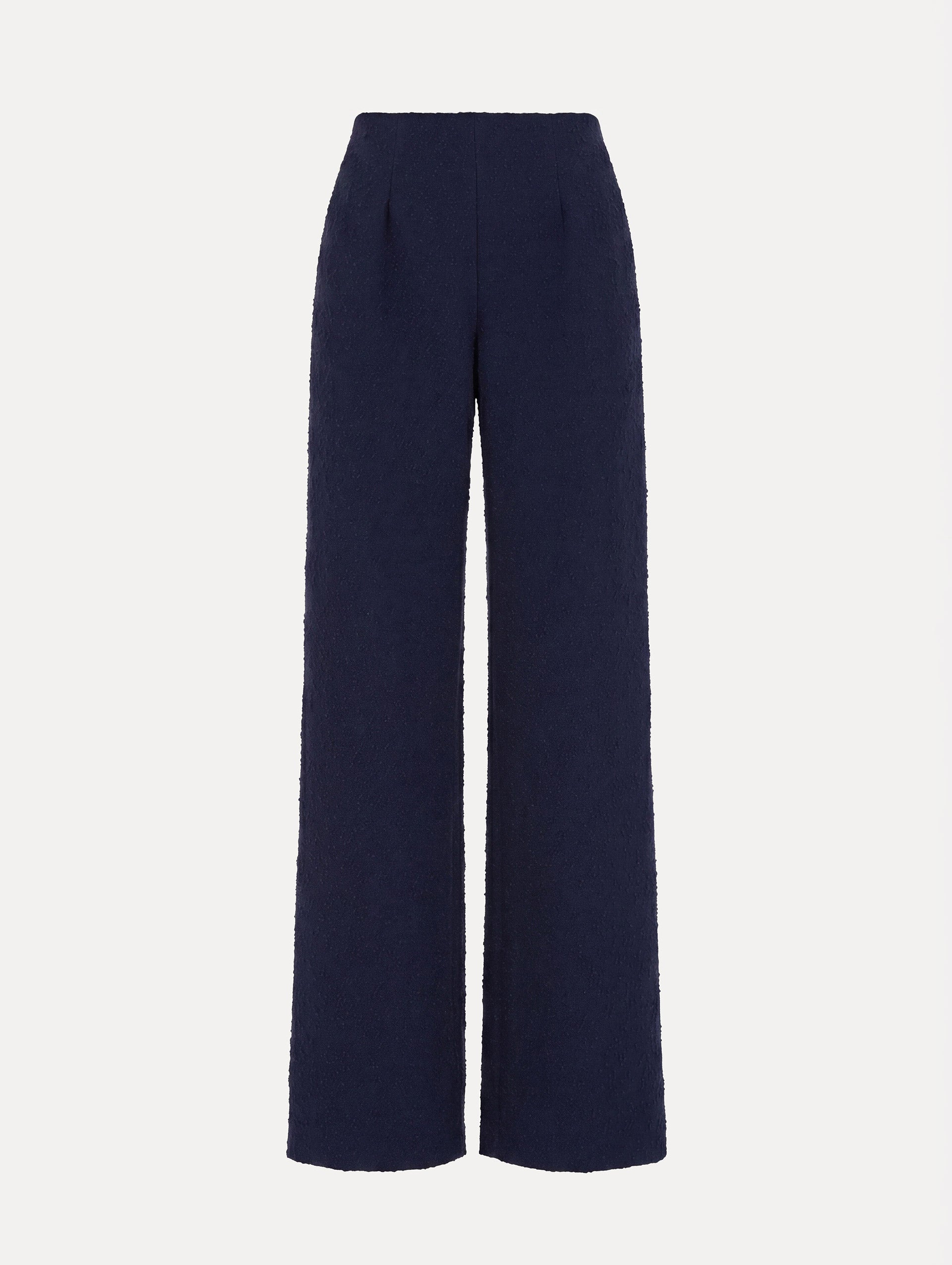 The model is wearing the slub wool tweed wide-leg pant in the color navy. 