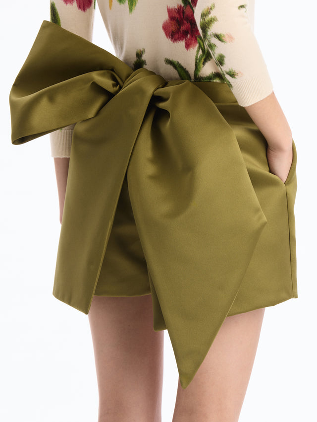 Draped Satin Mini Skort in Green. Bow Tie Back. Back Side View.