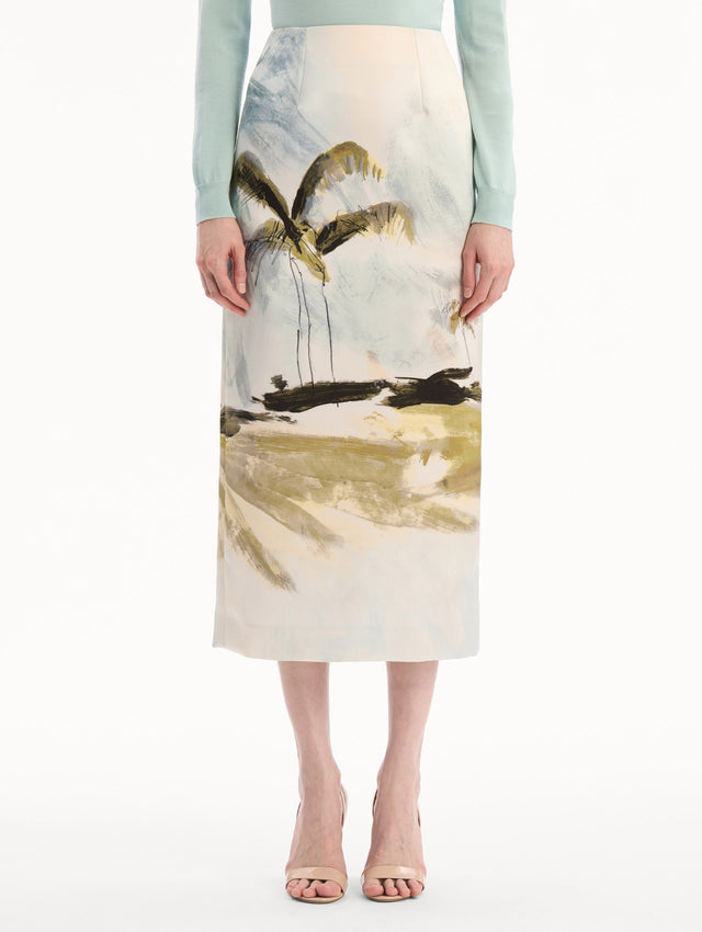 The model is wearing the Dominican Landscape Pencil Skirt printed in the Dominican landscape. Featuring a structured, column silhouette and midi length. Front View.