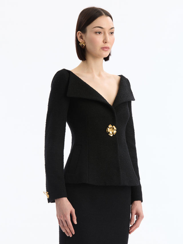 Black V-Neck Tweed Jacket with Gold Hibiscus Button. Side View. 