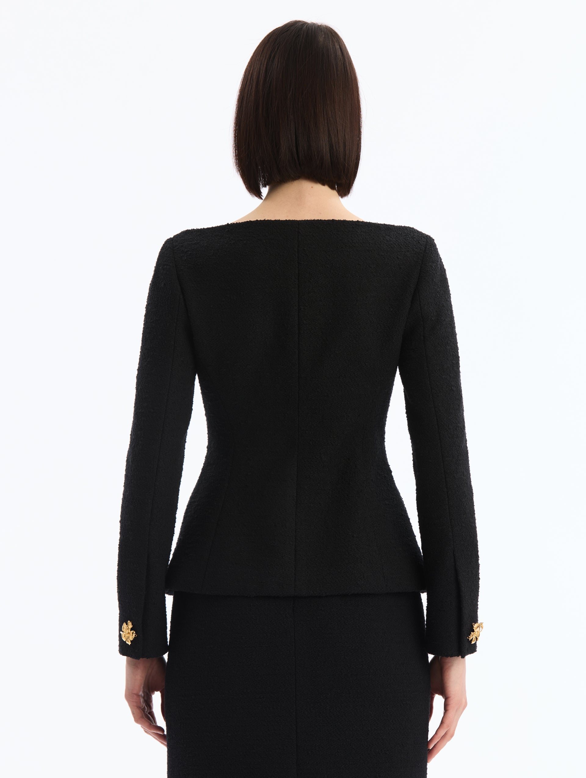 Black V-Neck Tweed Jacket with Gold Hibiscus Button. Back View. 