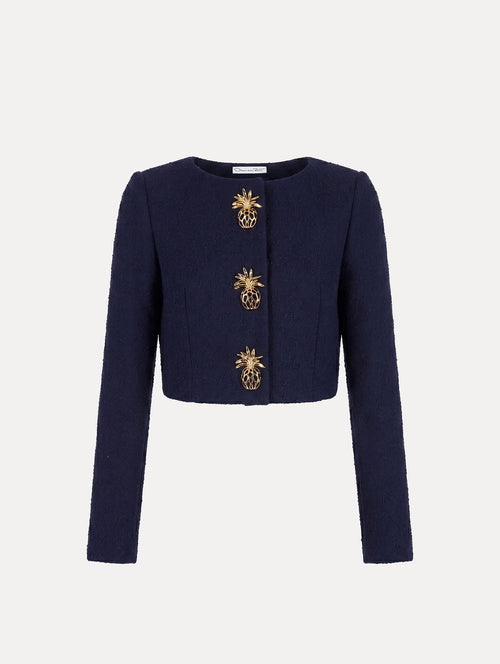 The model is wearing the slub wool tweed jacket with signature pineapple button detailing. 