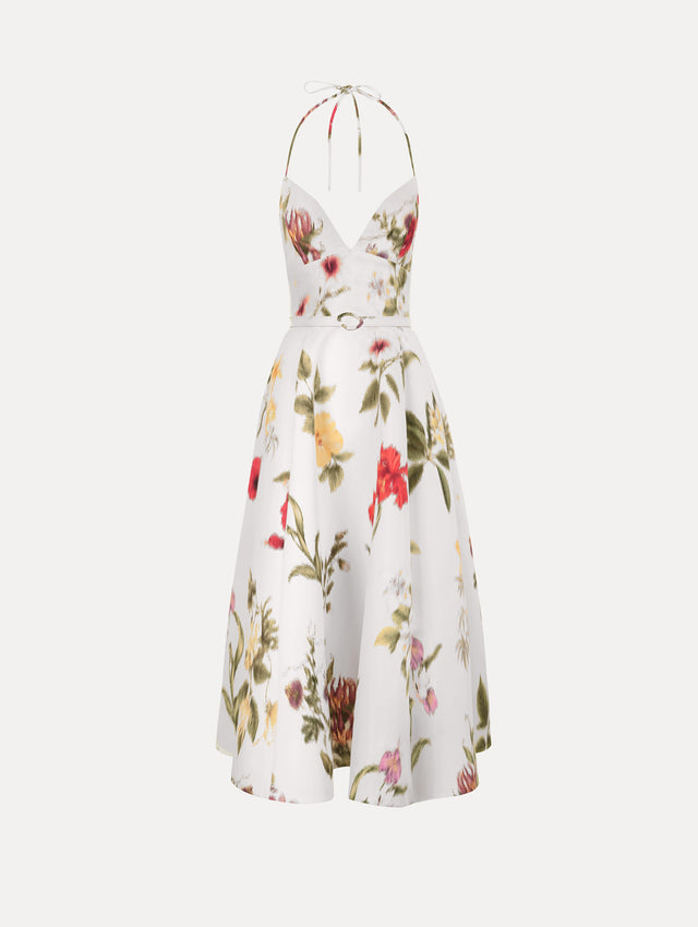 The Chiné Dominican Mixed-Floral Faille Cocktail Dress. Featuring a halter neckline, structured bodice, midi skirt, and belt at waist. Front View.
