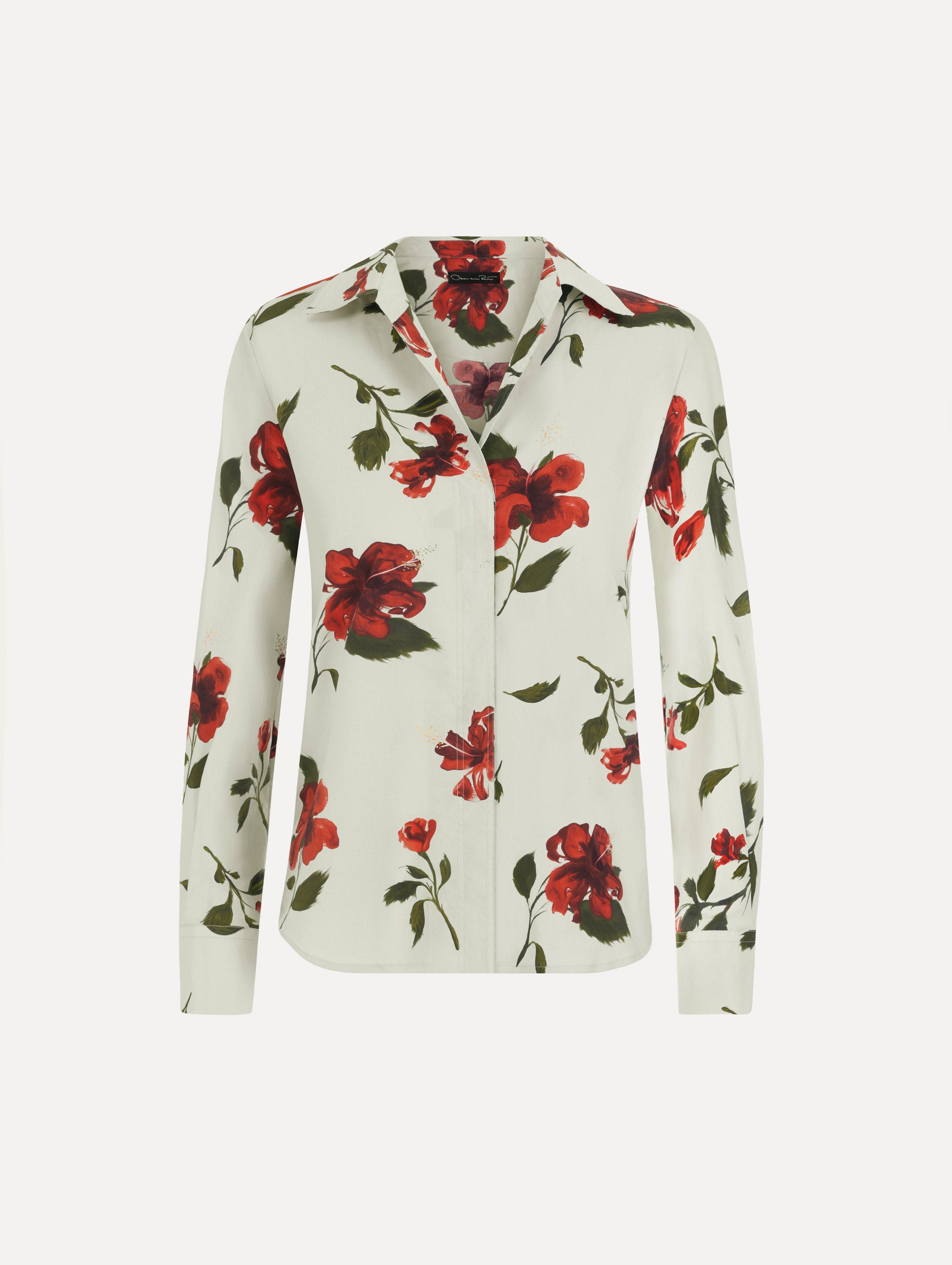The Hibiscus Cotton Poplin Blouse in a muted blue color printed with red hibiscus florals. Featuring a classic collar, button-front closure, long sleeves, and relaxed silhouette. Front View.
