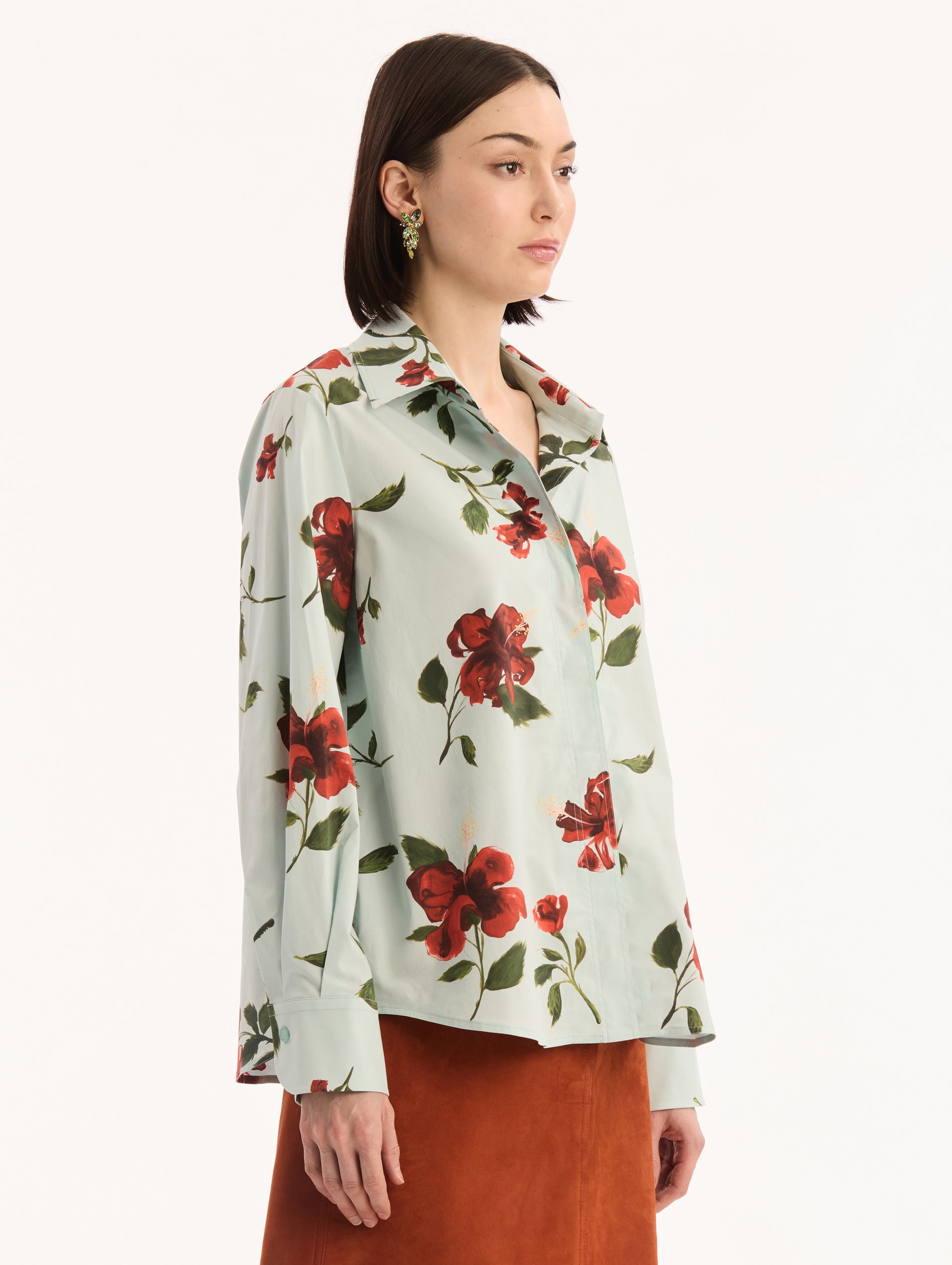 Cotton Poplin Button Up Blouse in Saltwater with Red Hibiscus Print. Side View.