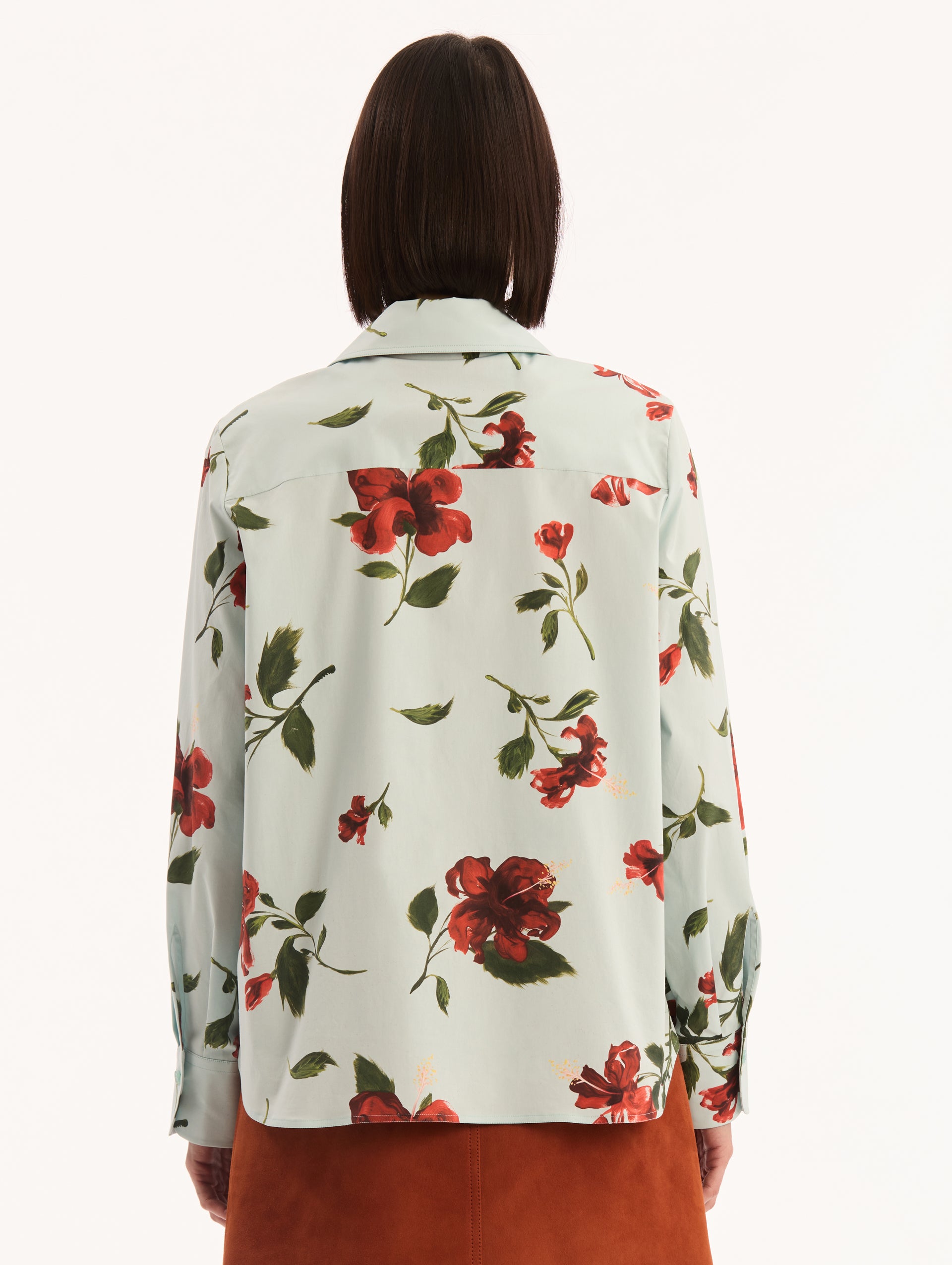 Cotton Poplin Button Up Blouse in Saltwater with Red Hibiscus Print. Back View.
