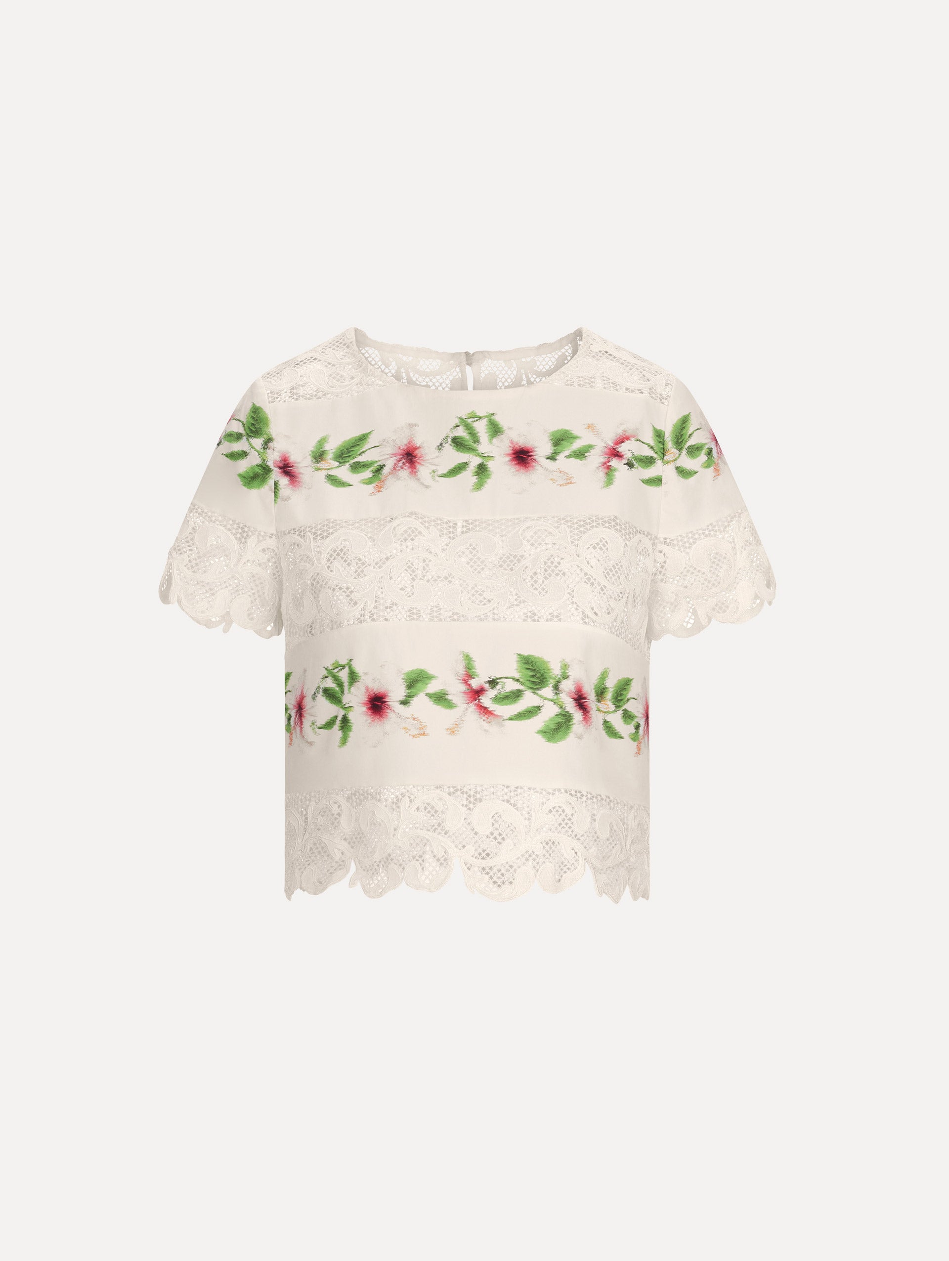 The model is wearing the chiné hibiscus striped cotton poplin blouse with guipure lace panels and a striped floral pattern in the color ivory.