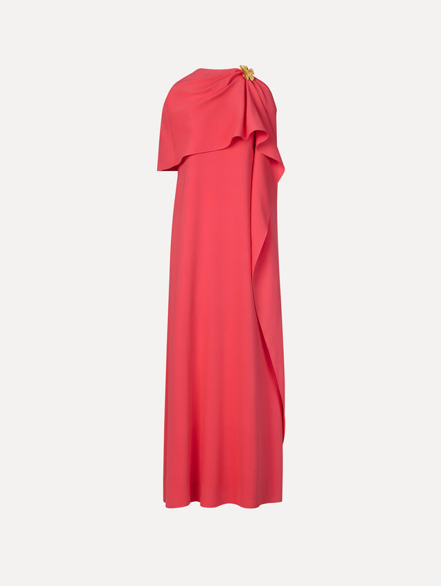 The Hibiscus Brooch Georgette Caftan in Hot Pink. Featuring a softly structured cape silhouette and a sculptural hibiscus brooch accent at the shoulder. Front View.