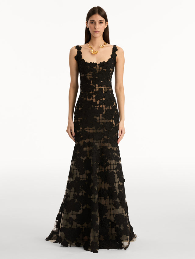 Black Floral Cutout Threadwork Gown with semi sheer floral pattern and flared floor length hem line. Front View.