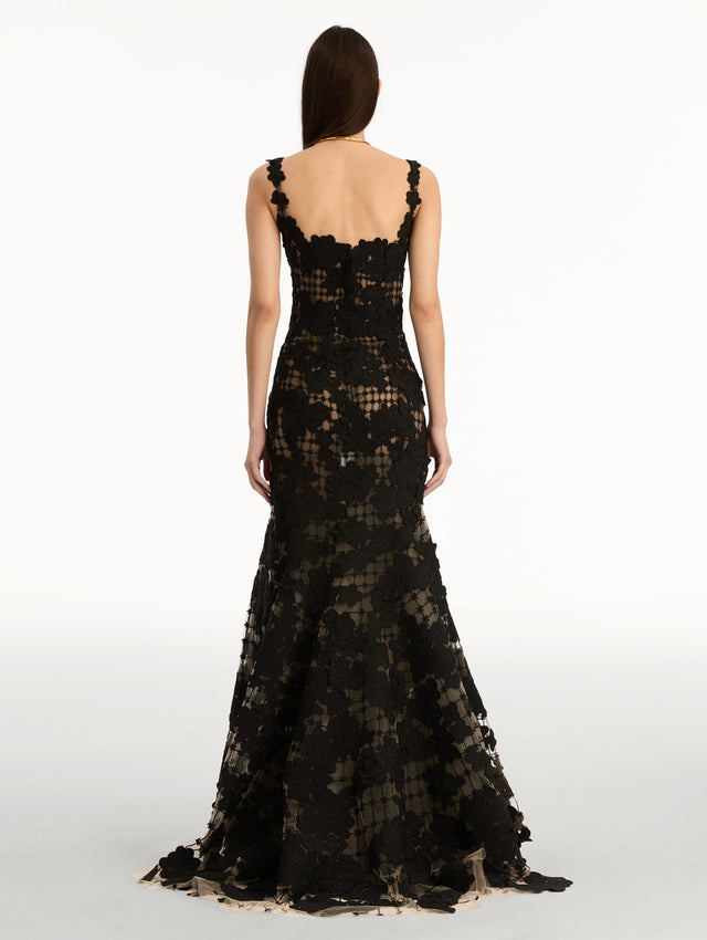 Black Floral Cutout Threadwork Gown with semi sheer floral pattern and flared floor length hem line. Back View.