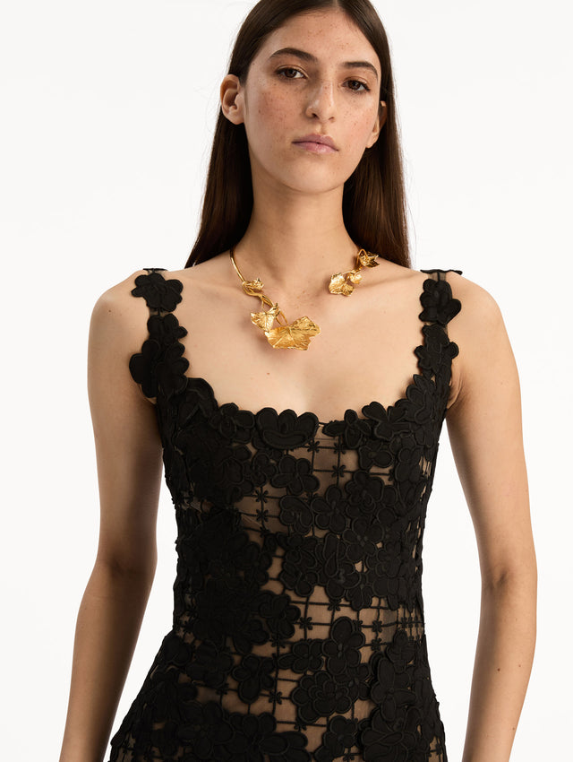 Black Floral Cutout Threadwork Gown with semi sheer floral pattern and flared floor length hem line. Zoom View.