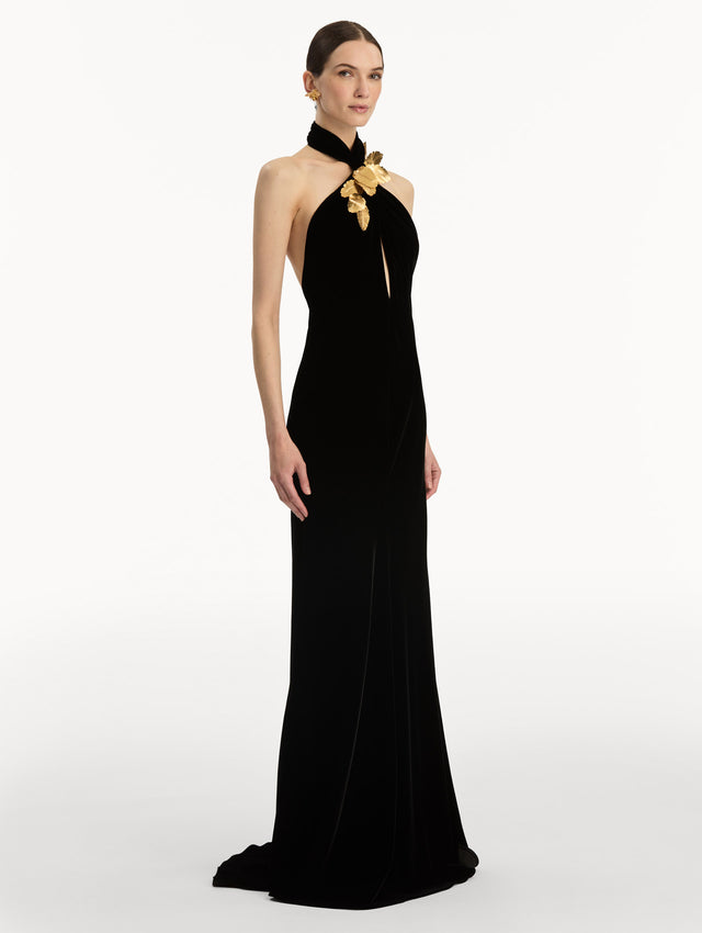 Black Gold Leaf Embroidered Velvet Gown with a wrap halter neckline and keyhole. Side View.